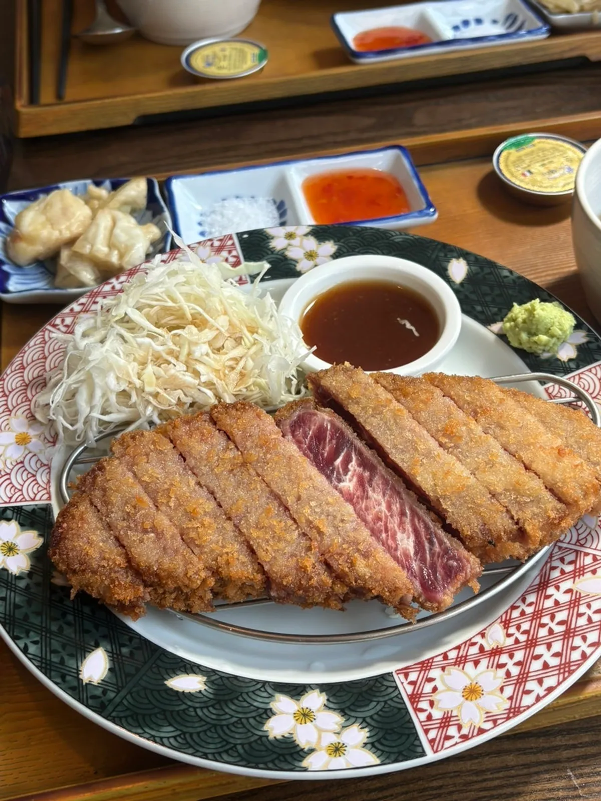 A piece of gyukatsu grilled on the personal tabletop grill
