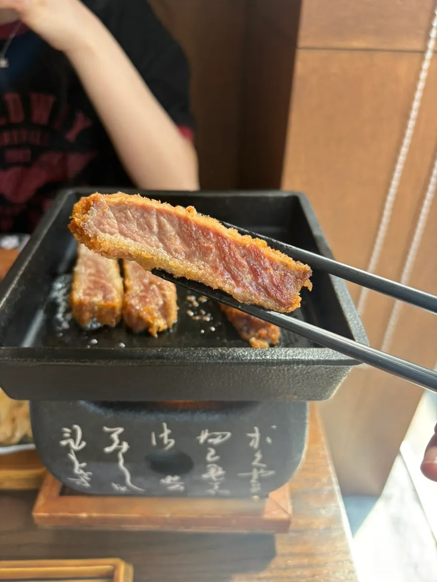Cross-section of gyukatsu cooking on the grill