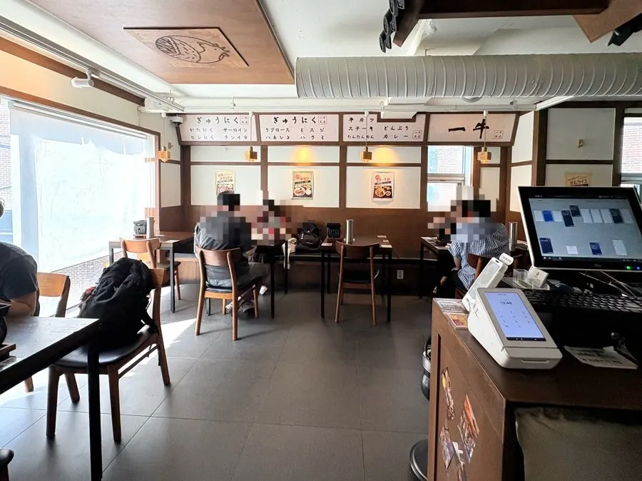 Quiet table seating inside the Ichigyu restaurant