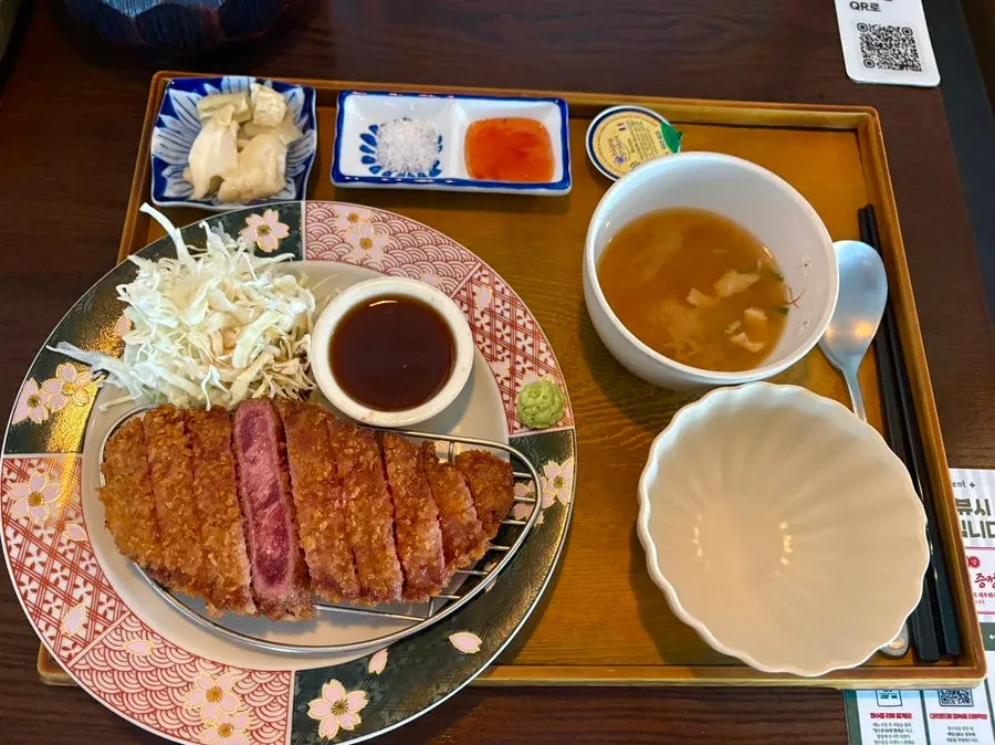 Gyukatsu set spread with rice, soup and salad