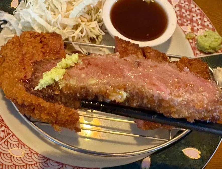 A piece of gyukatsu grilled in Isigny butter and dipped in sauce