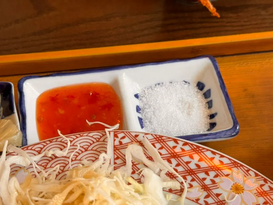 Grilling a piece of gyukatsu on the plate
