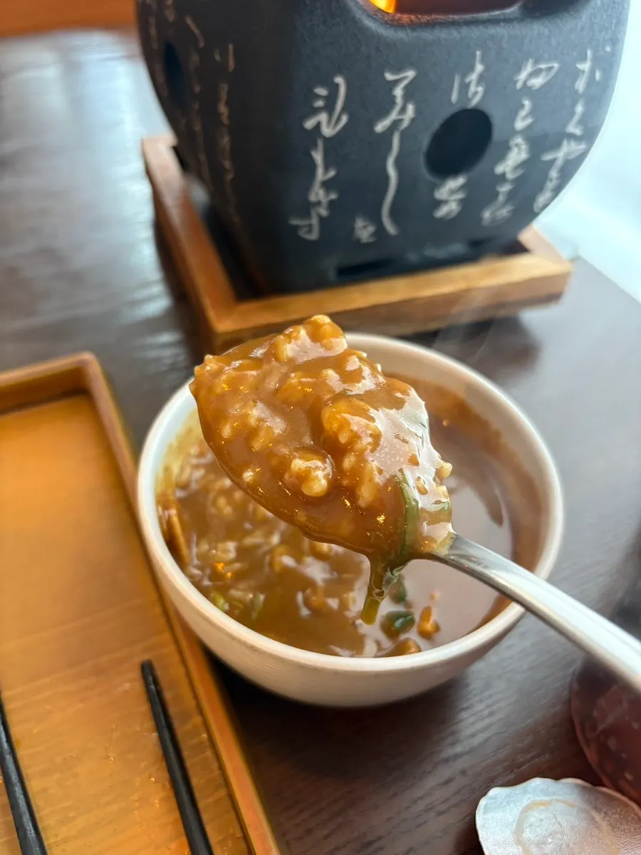 A piece of gyukatsu with salt and wasabi