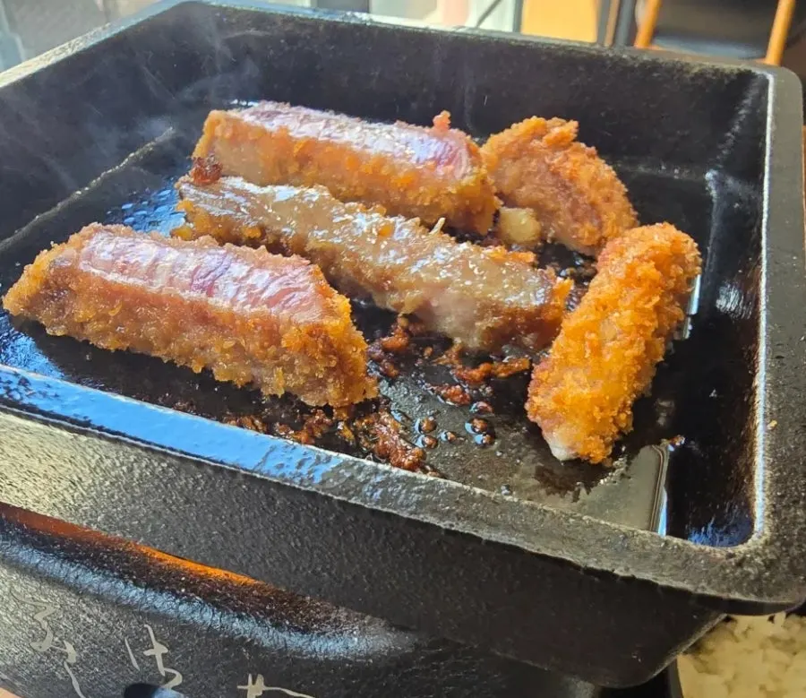 Grilling gyukatsu on a personal mini brazier