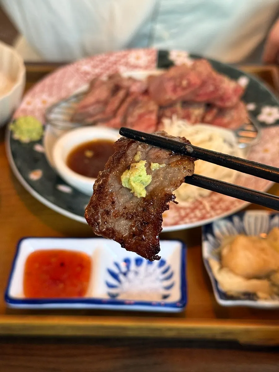 A piece of steki topped with wasabi