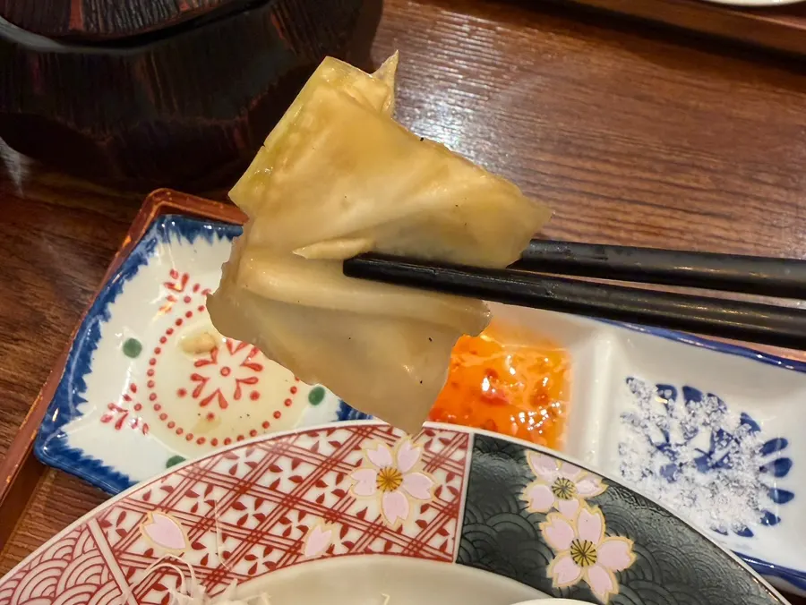Side dishes of pickled cabbage and miso soup