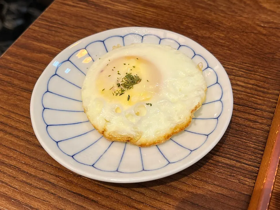 Extra fried egg served alongside rice