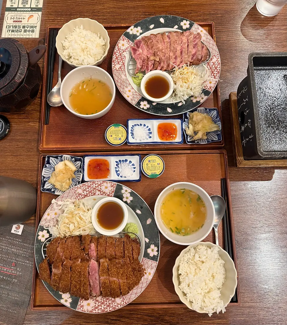 Table spread with jumbo sirloin gyukatsu and steki set together
