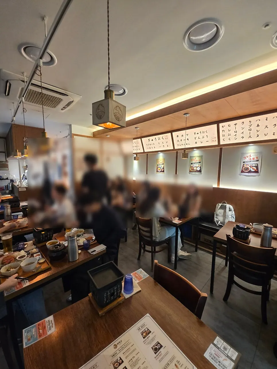 Interior of Ichigyu Seoul Station Branch packed with Friday evening diners