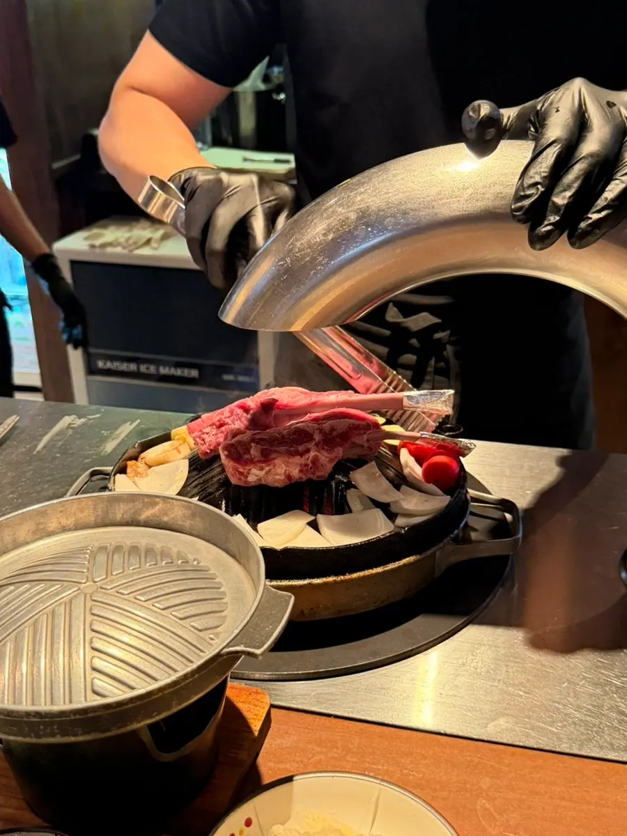 Lamb ribs placed on the dedicated grill