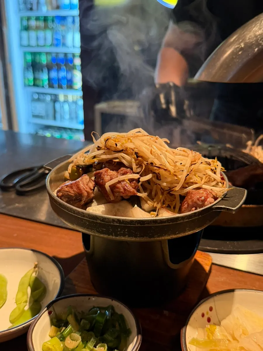 A grill piled high with bean sprouts
