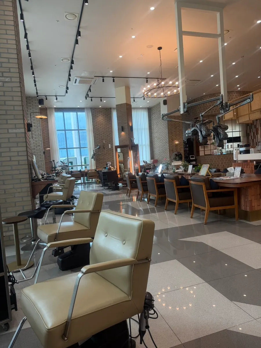 High-ceilinged salon interior and waiting area