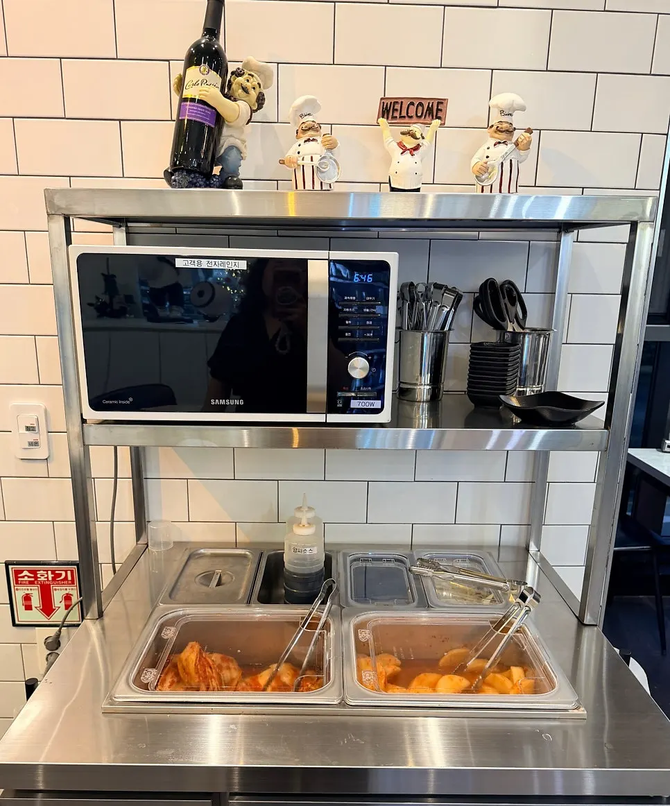 Table set up with phone charger and apron