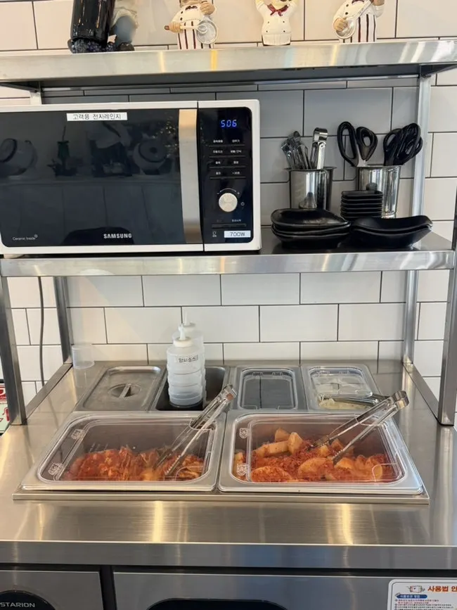 Self-serve bar with aprons and kimchi