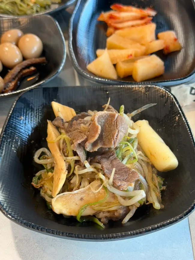A bite of cooked scallion bulgogi