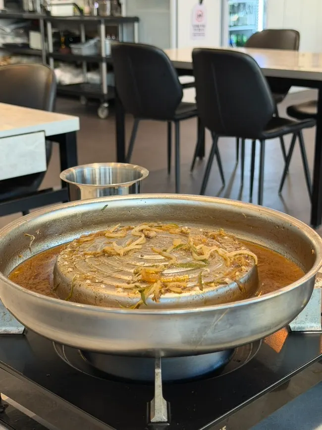 Pot of bulgogi with the portion shrinking
