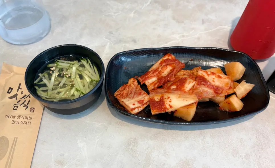 Kimchi, onions, and onion sauce at the self-serve bar