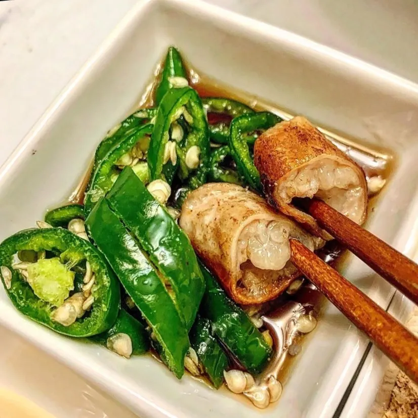 Whole grilled daechang eaten with the included sauce