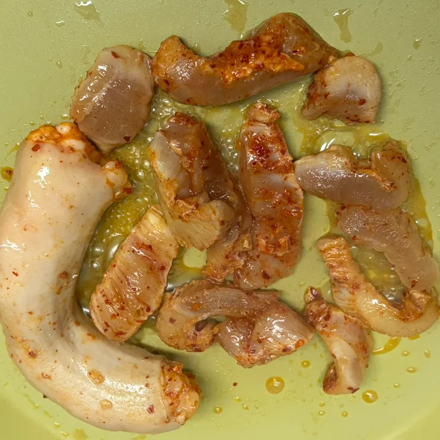 Plump daechang grilling in a frying pan