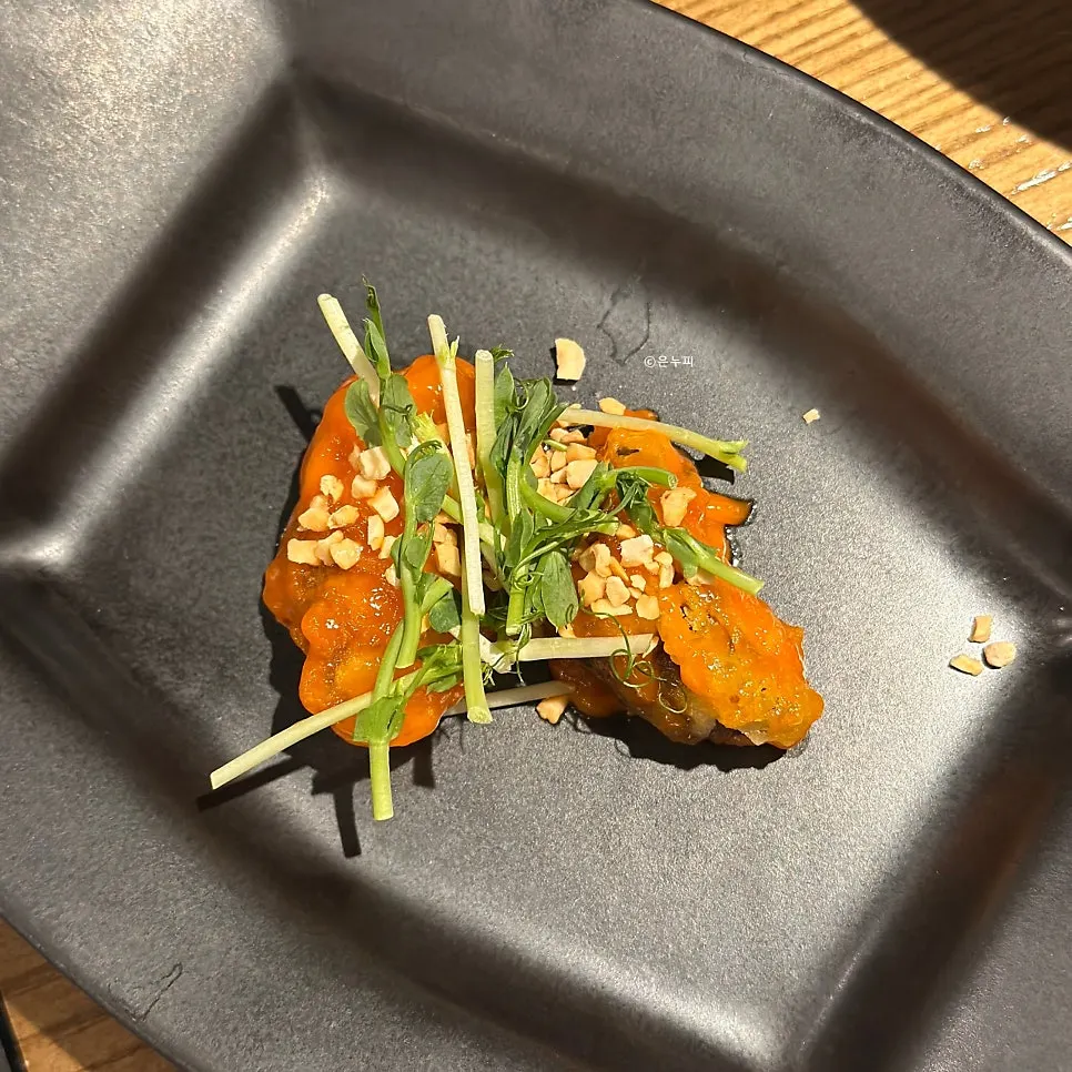 Mung bean porridge topped with black sesame appetizer