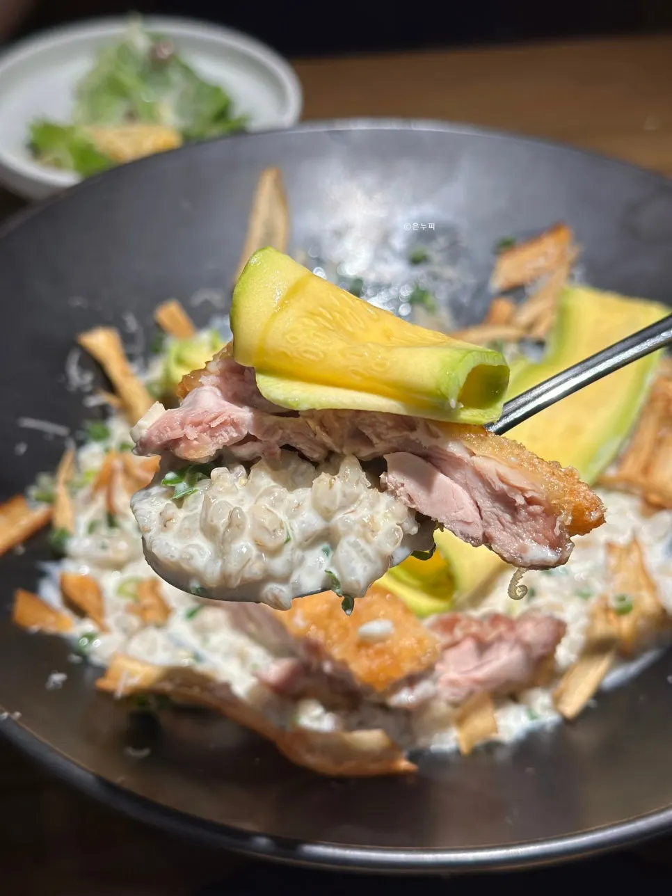 Barley cream risotto topped with chicken