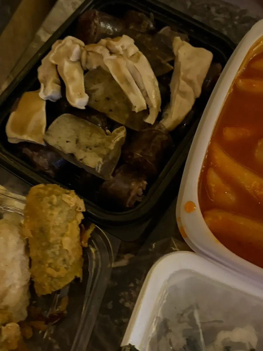 Full spread of tteokbokki, sundae, fried snacks, and rice ball