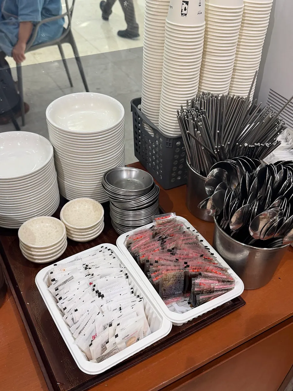 Self-serve corner with pickled radish and spoons