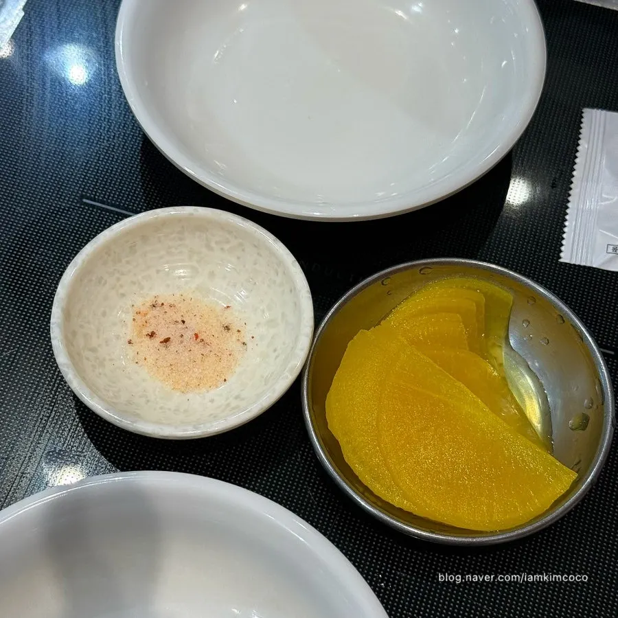 Pickled radish and salt at the self-bar inside the restaurant