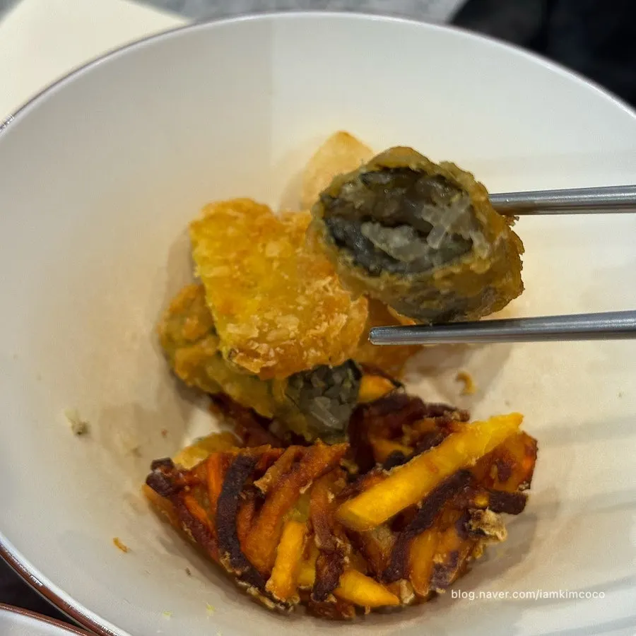 Fried snack soaked deep in tteokbokki sauce