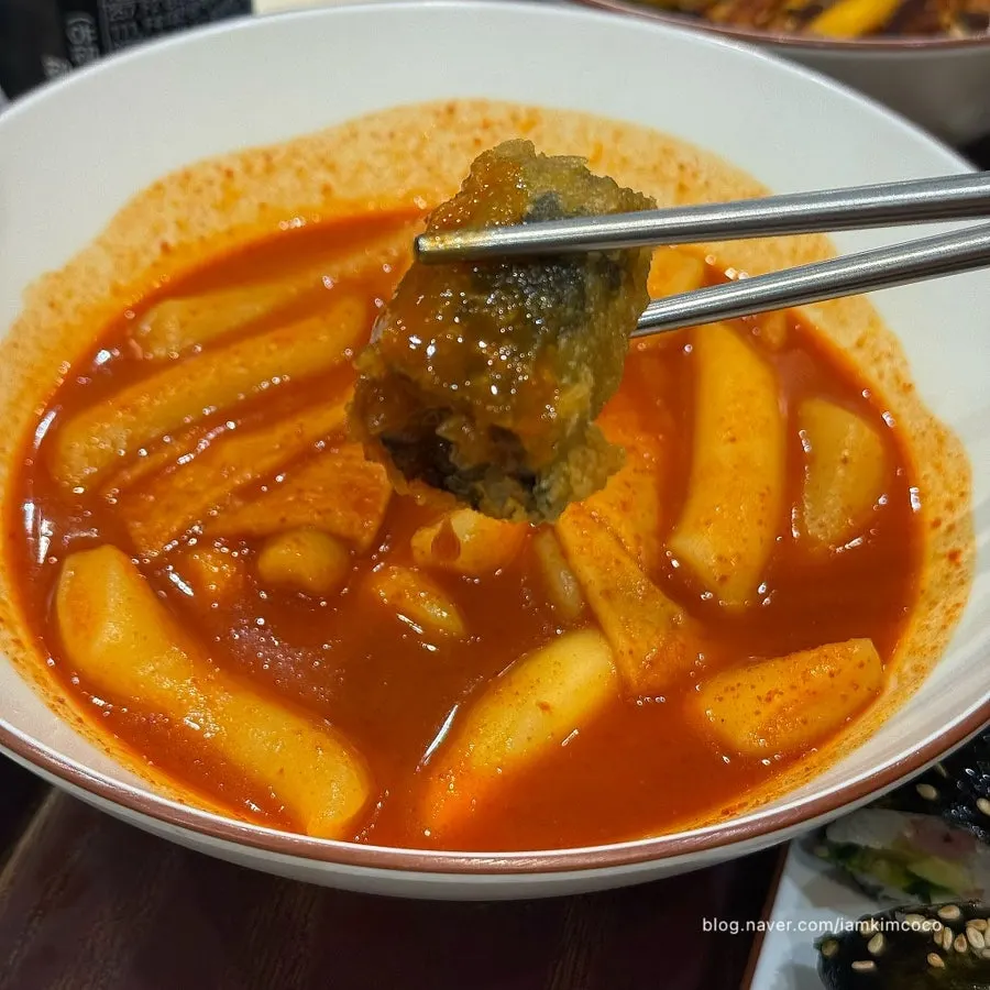 Tteokbokki and assorted fried snacks laid out together