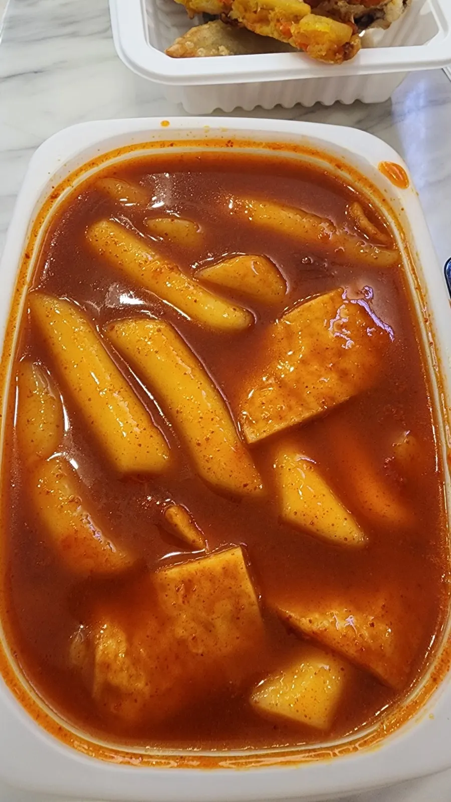 The Hyeonseon-i Set with tteokbokki, fried snacks, gimbap, and sundae