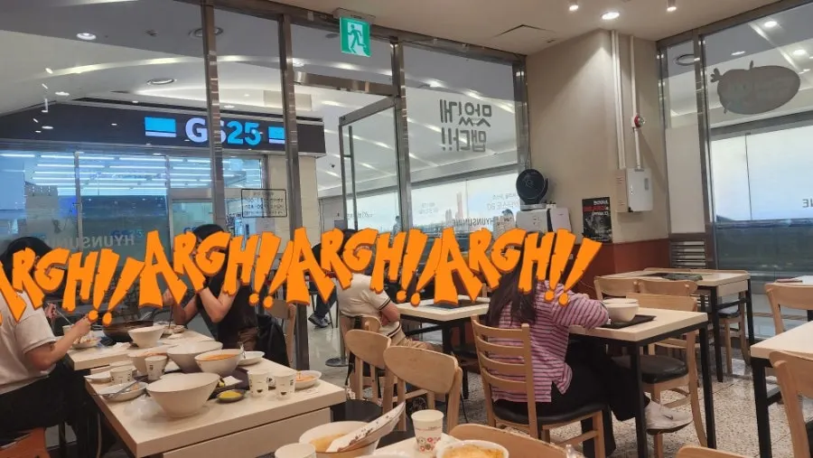 A bite of fried snack dipped in tteokbokki broth