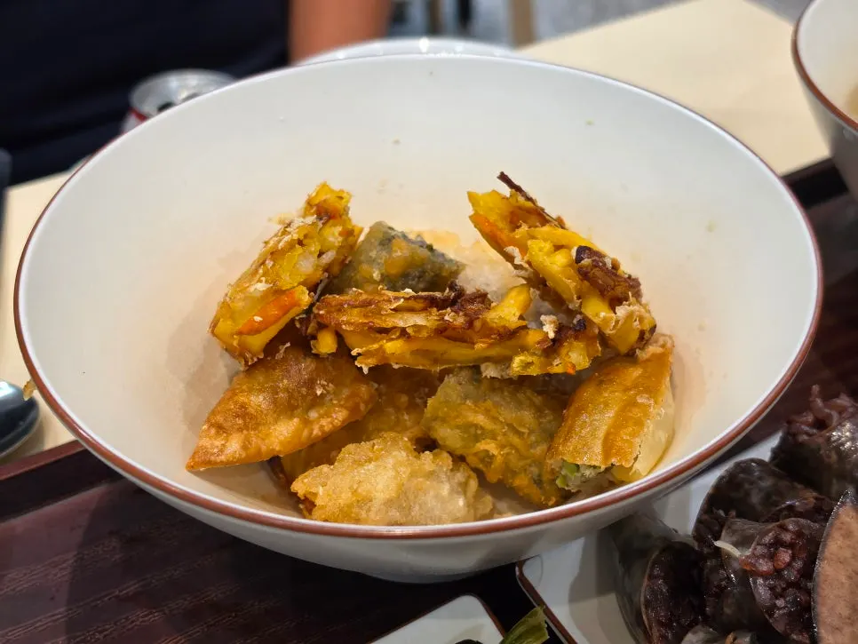 Assorted fried snacks: sweet potato, fried dumpling, vegetable, squid, and kimmari