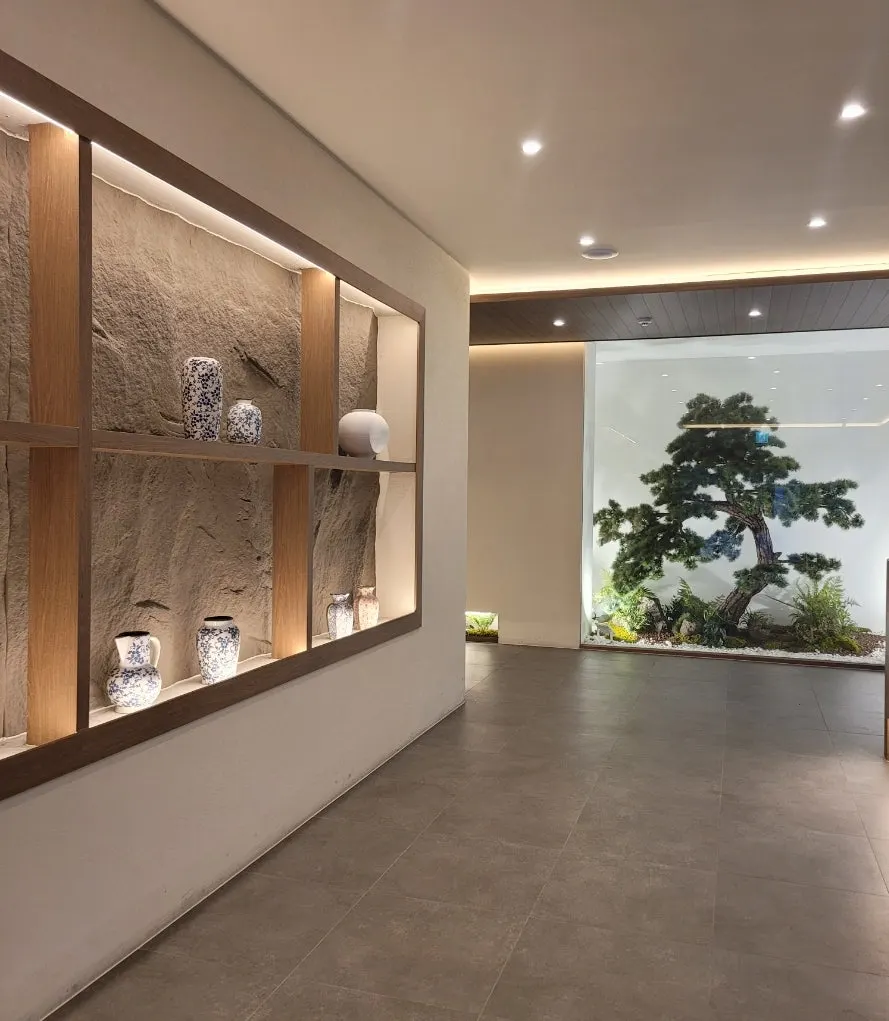 Restaurant entrance with white-toned walls and ceramic decorations