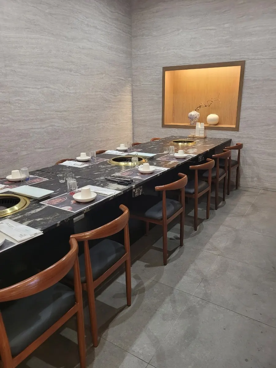 Spacious dining hall with a pine tree painting on the wall