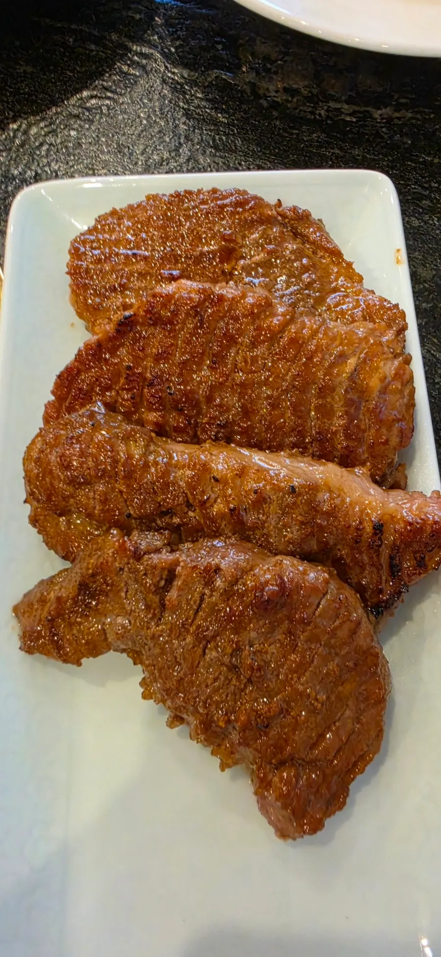 Marinated pork ribs grilling on the pan
