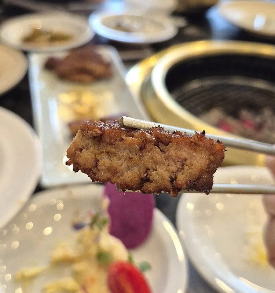 Well-grilled marinated pork ribs on the grill