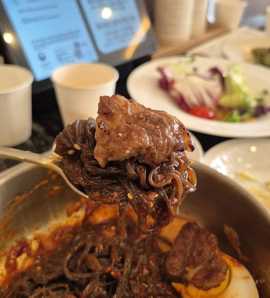Bibim-naengmyeon topped with marinated pork rib