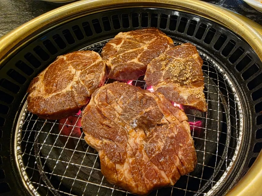 Pork galbi grilling over charcoal