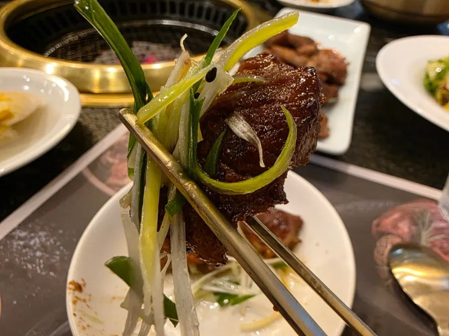 Pork galbi served with scallion salad