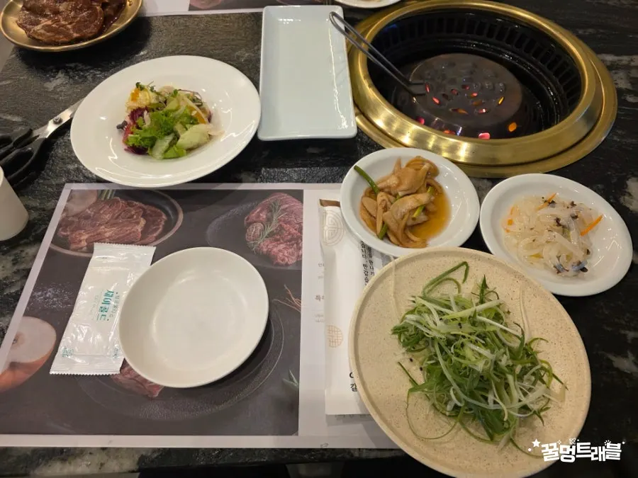 Table set with two servings of pork ribs