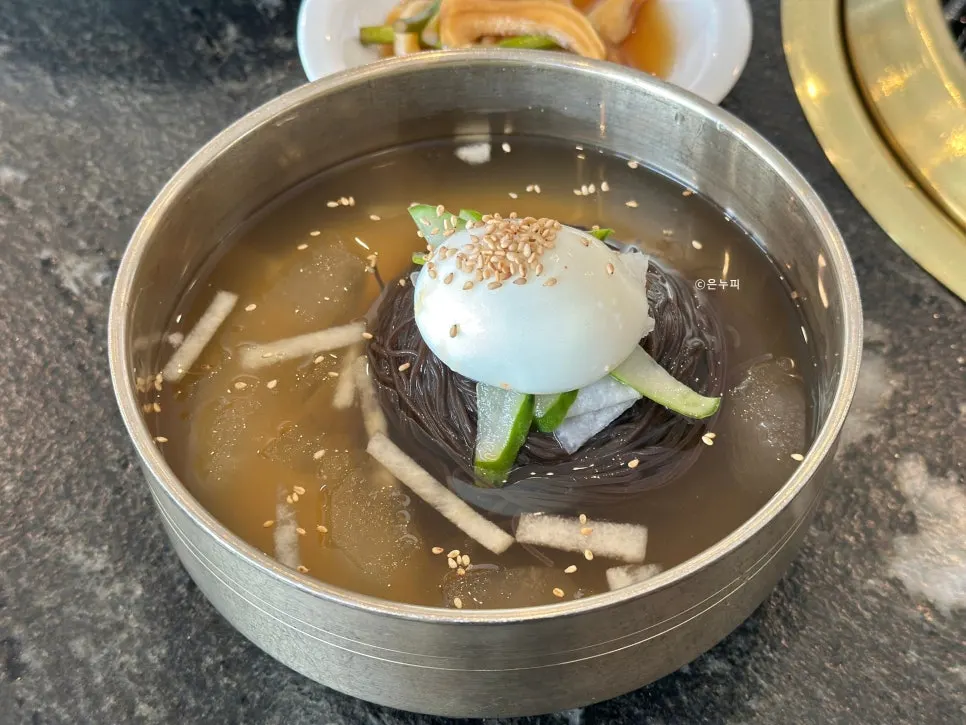 Meat served with rice and side dishes