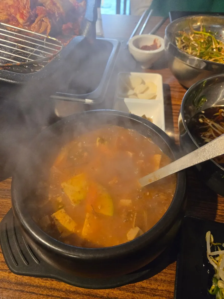 Bubbling doenjang jjigae in a stone pot