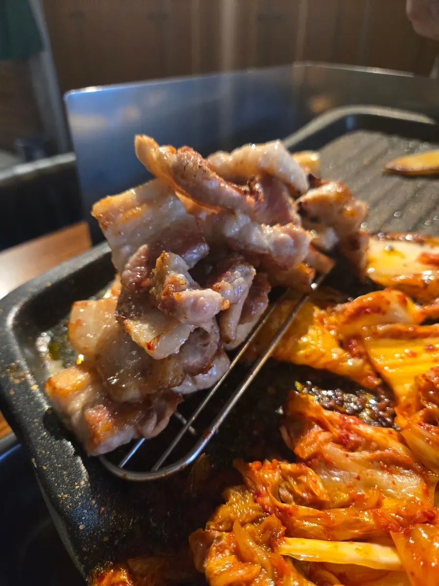 Kimchi grilled golden brown in the meat's fat