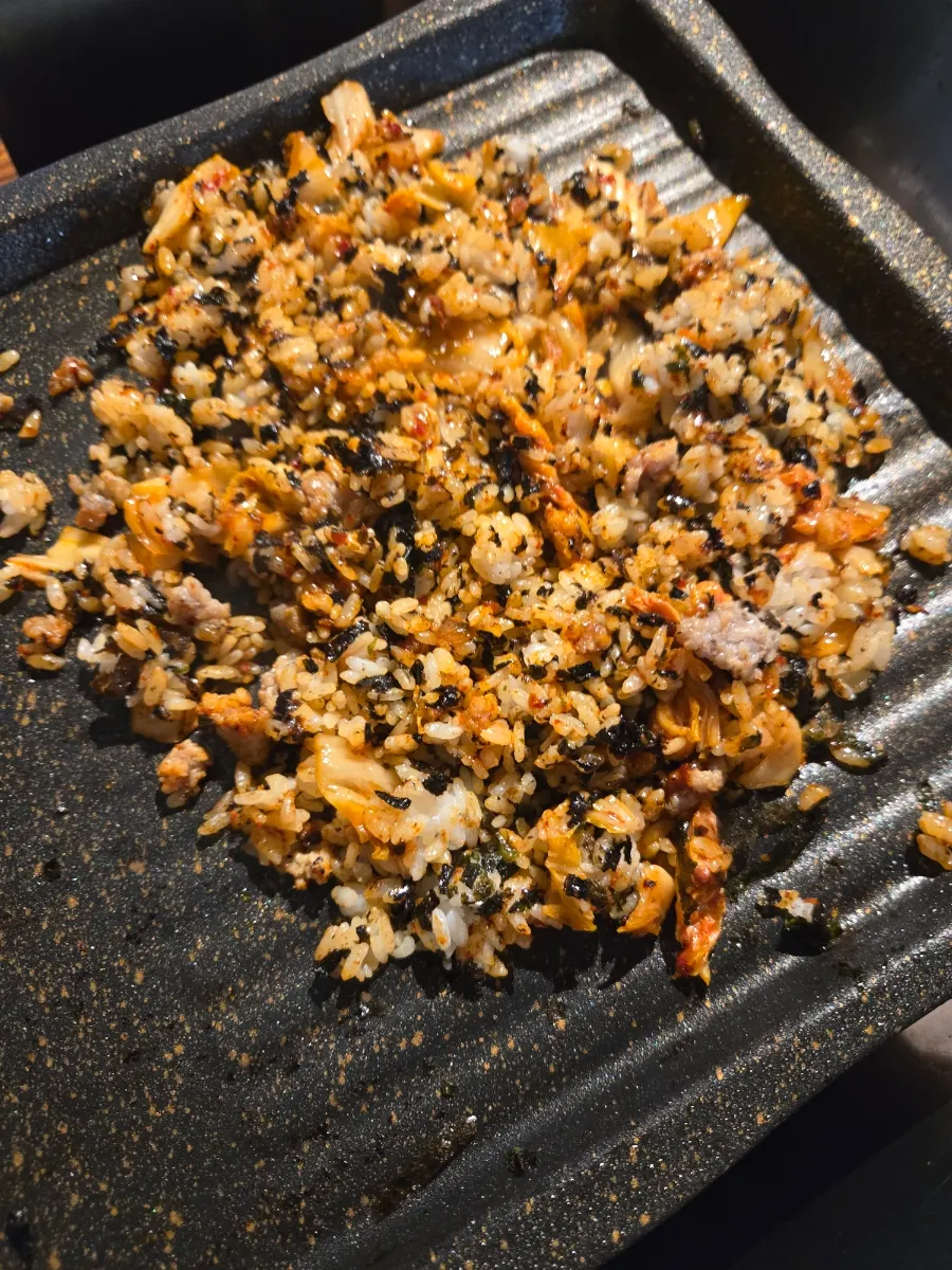 Kimchi fried rice with gim flakes cooked on the grill