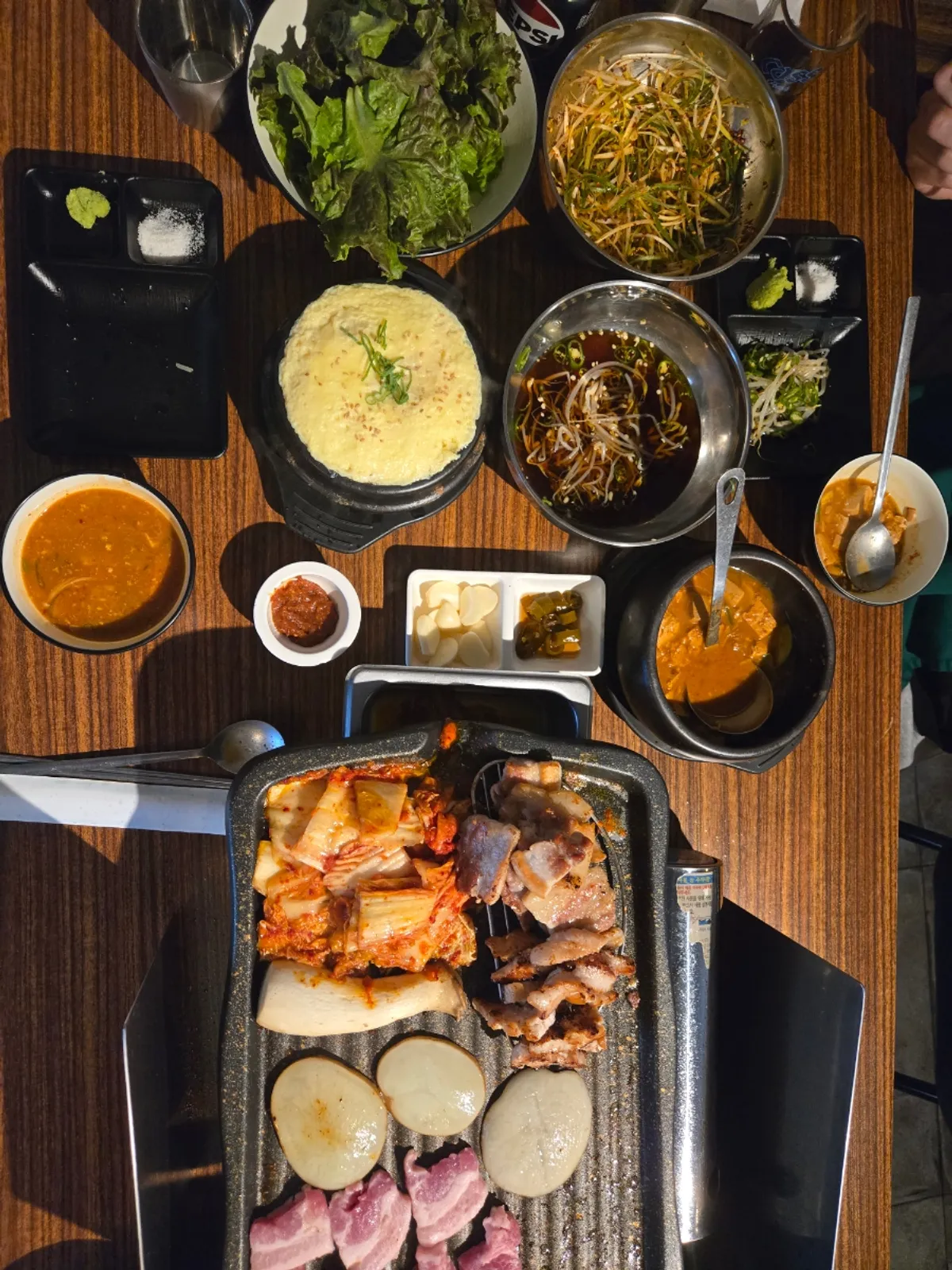 A bite of pork belly paired with grilled kimchi