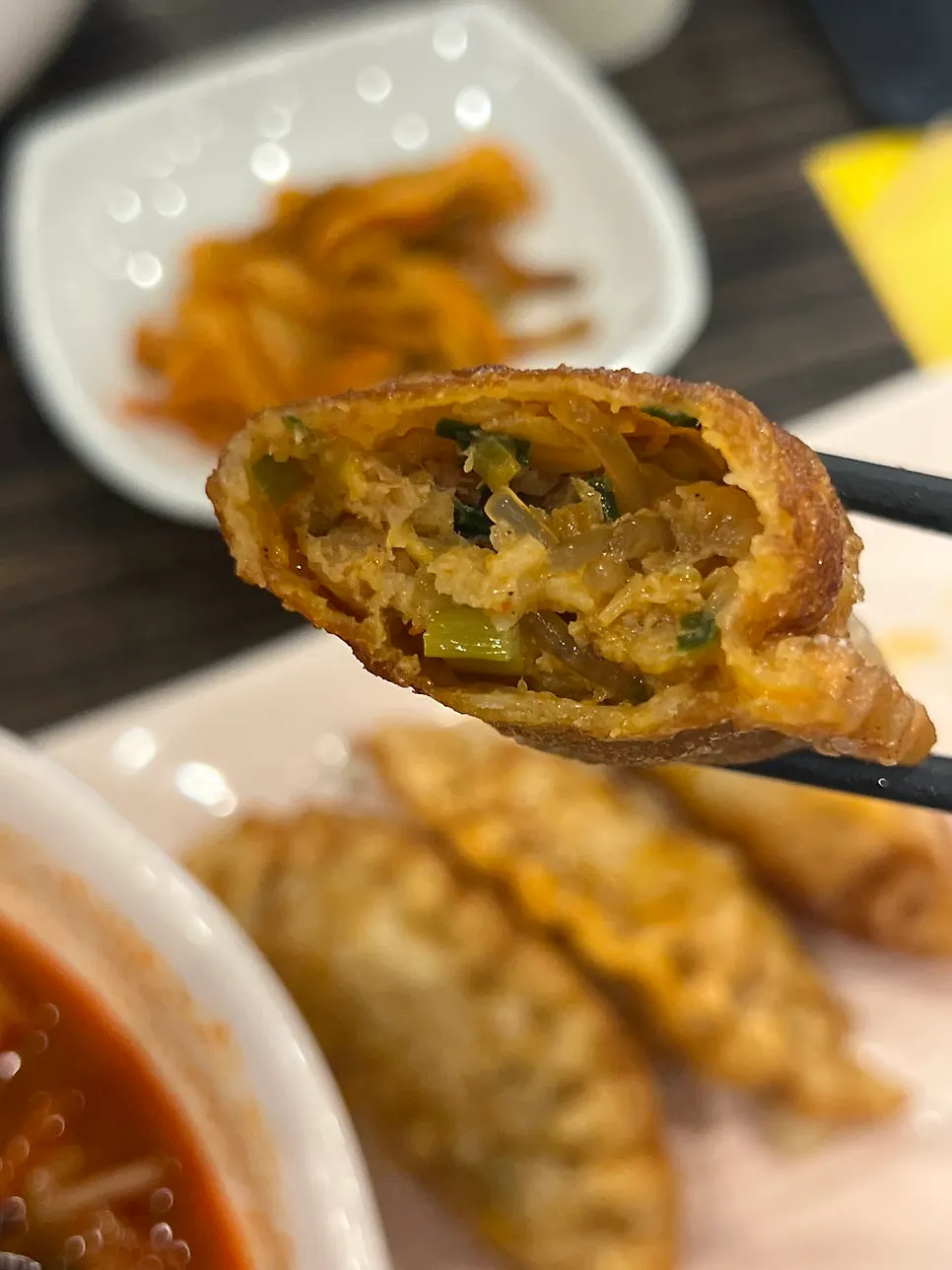 Small glutinous tangsuyuk served with sauce already poured on