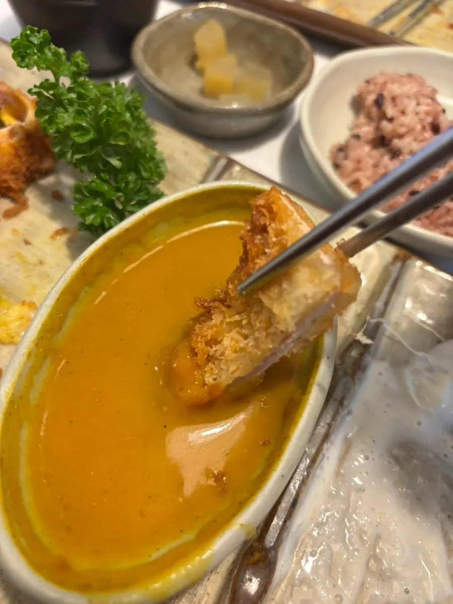 Curry roll katsu table setting served with rice