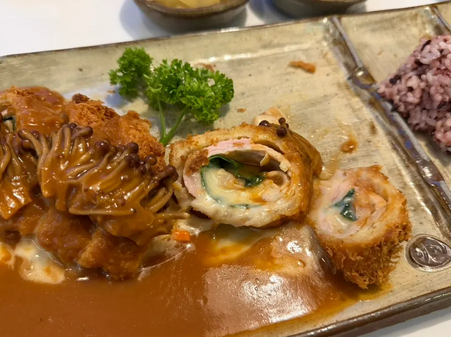 Cross-section of the round mushroom cheese roll katsu full of cheese