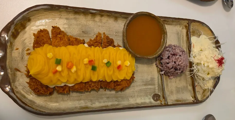 A plate of sweet potato cheese pork cutlet